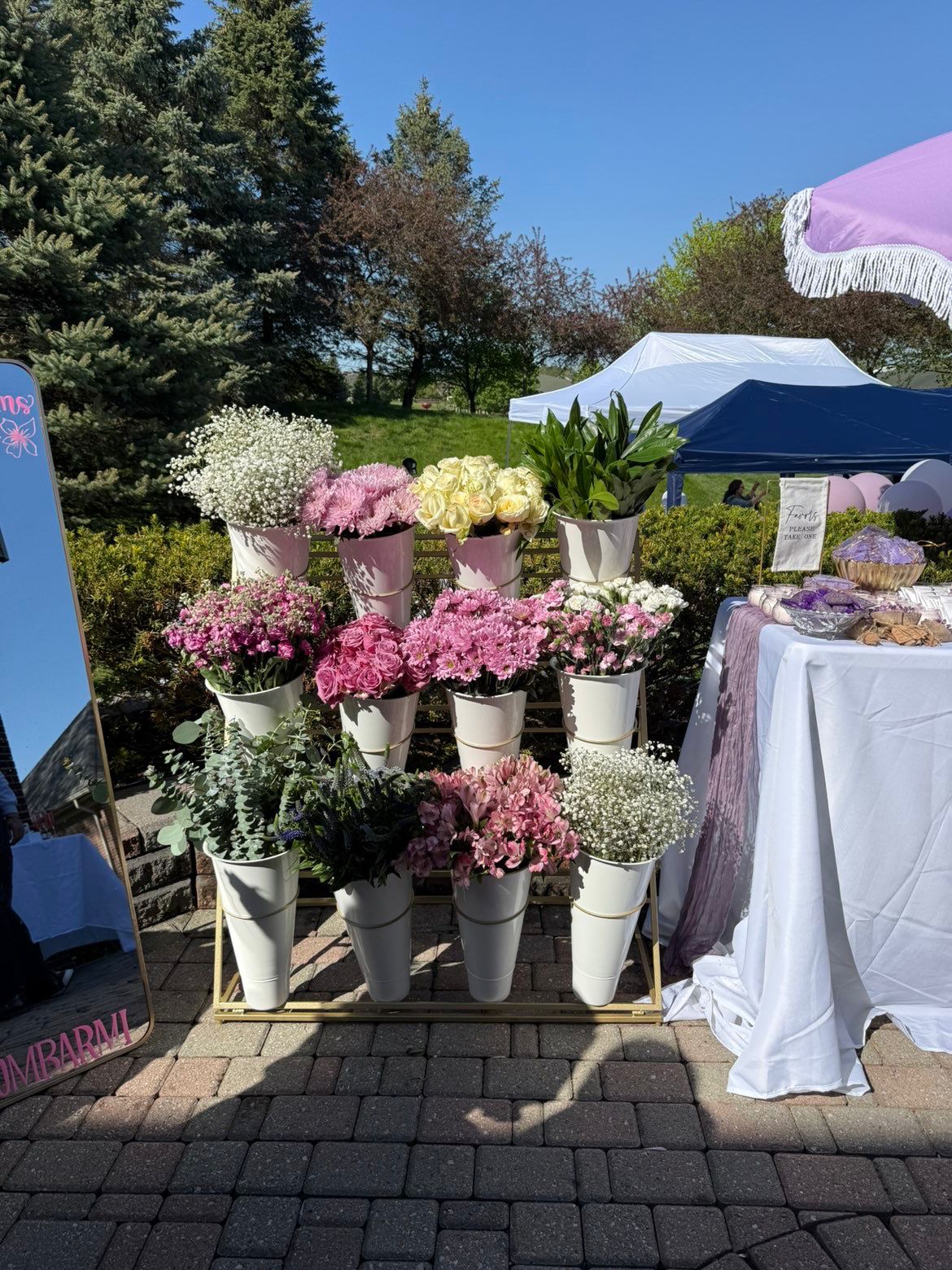 Bloom Bar display with lavender and pink blooms at an outdoor market